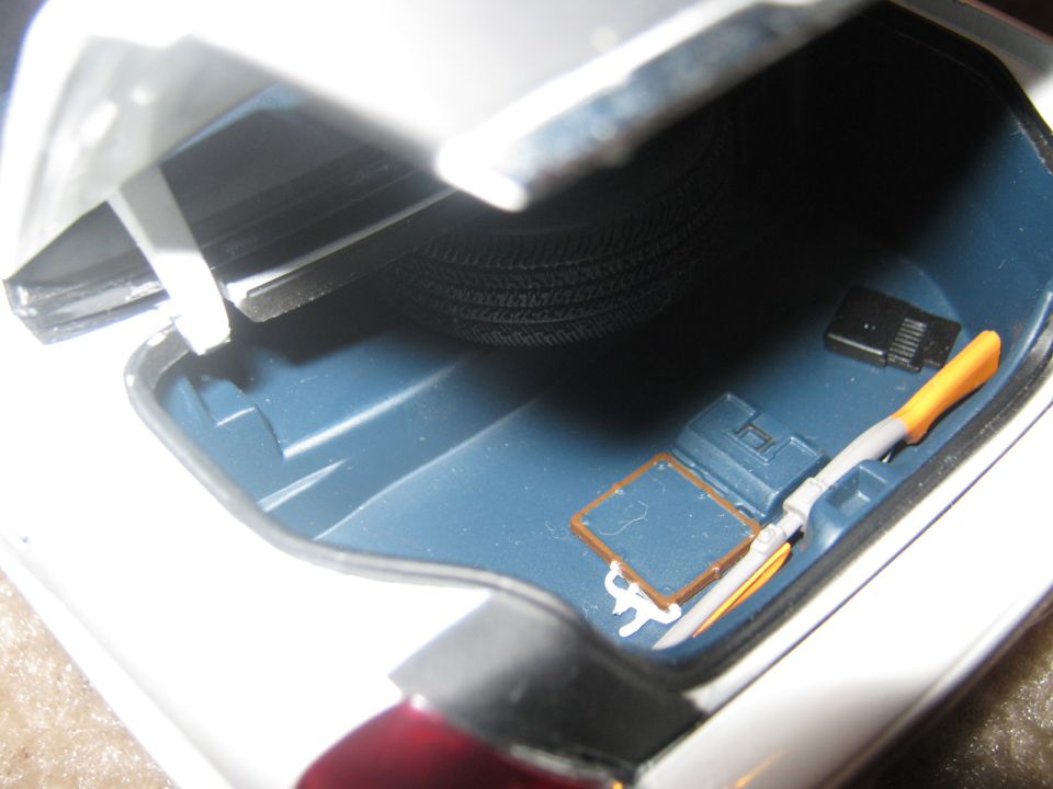 Trunk interior with spare tire, jack, and tools