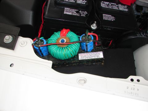 1992 Ford Taurus - Electrical components, including a car battery and a custom filter, are visible in the engine bay.