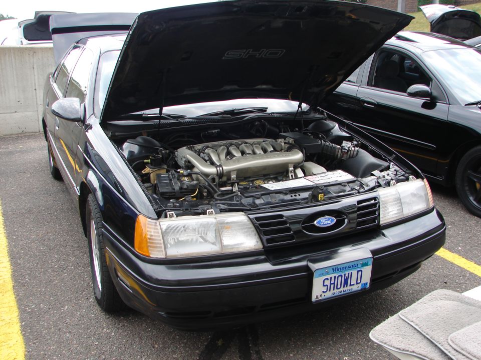 1992 Ford Taurus SHO with hood open, front view. Engine visible