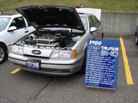 1992 Ford Taurus - A blue sign details the 1989 Ford Taurus SHO's specifications and ownership history.