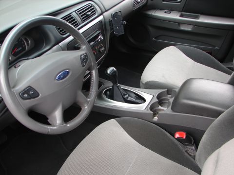 1992 Ford Taurus - Interior view of a car, likely a Ford Taurus from the early 2000s, with a prominent Ford steering wheel emblem.