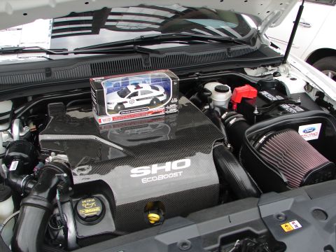 1992 Ford Taurus - A toy police car sits atop the SHO EcoBoost engine cover in this vehicle registry photo.