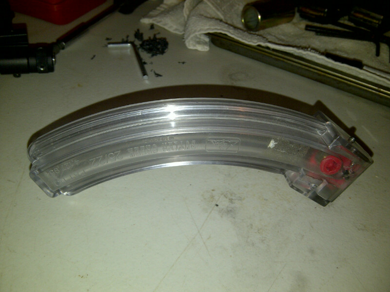 Clear turn signal lens with visible text and red internal components