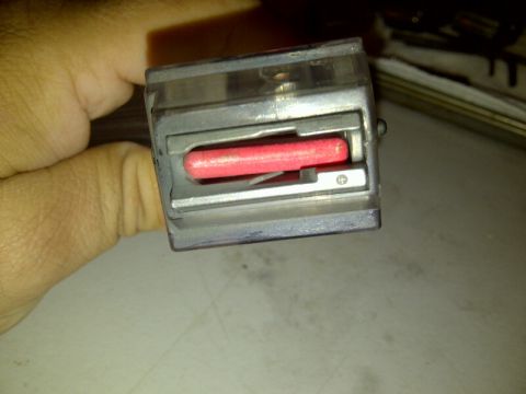 1989 Ford Bronco - A mechanical part with a red insert is held in a hand, with a Supermotors.net logo visible.