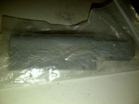 1989 Ford Bronco - A gray rectangular part is shown inside plastic packaging with a Supermotors.net watermark.