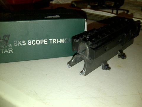 1989 Ford Bronco - SKS scope mount and its original packaging are shown on a table.