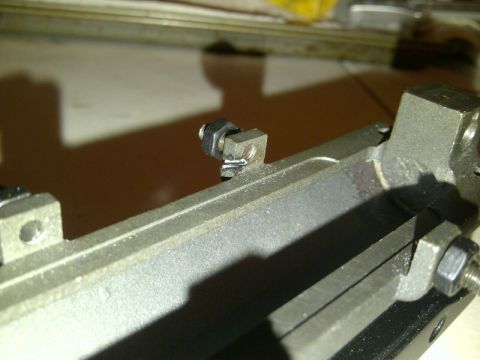 1989 Ford Bronco - A metal bracket with fasteners is shown in a close-up view, with text visible at the bottom.