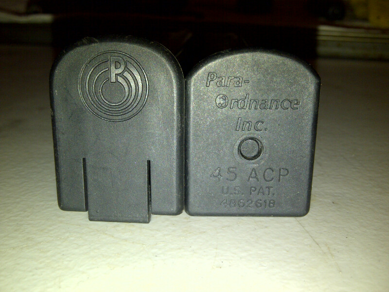 Two Para-Ordnance Inc. 45 ACP magazines, one with a circular logo