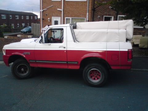 1989 Ford Bronco - This two-tone Ford Bronco is loaded up with a mattress in its cargo area.