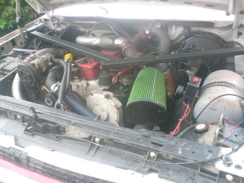 1989 Ford Bronco - Custom engine modifications visible in the engine bay, including a large air intake and turbo.