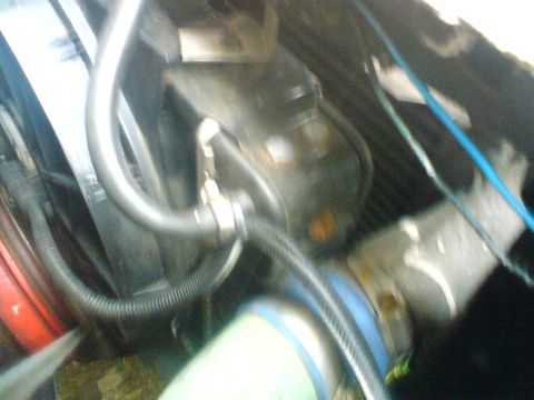 1989 Ford Bronco - Close-up view of hoses and radiator in an engine bay, with 'Supermotors.net' watermark visible.