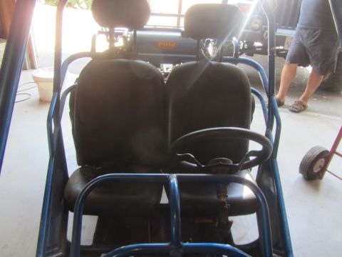 1968 Ford Mustang - Interior view of a buggy with two seats and a steering wheel. 'PITT' is visible on a rear panel.