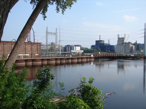 1992 Ford Taurus - A view of an industrial waterfront with a river in the foreground and buildings in the background.