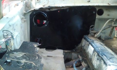 1978 Ford Bronco - View of the AC box and surrounding components in the engine bay of a vehicle.