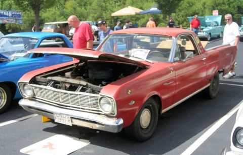 1976 Ford Ranchero - Red 1971 Ford Ranchero on display at a car show, hood raised to reveal the engine.
