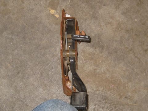 1996 Ford Bronco - This brake pedal assembly features a "BRAKE RELEASE" lever and is shown against a concrete floor.
