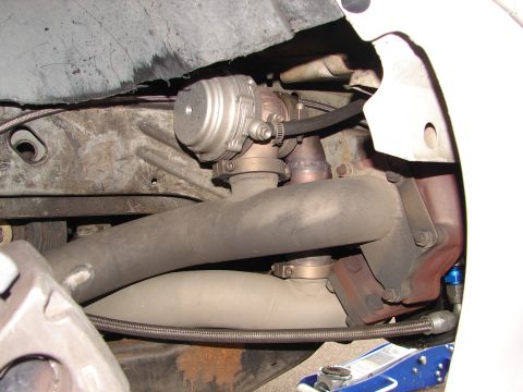 1992 Ford Taurus - Close-up view of a turbocharger and exhaust manifold assembly, likely from a performance vehicle.