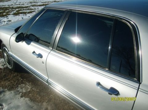 2000 Mercury Grand Marquis - This silver sedan has chrome trim and tinted windows, with a date stamp of 01/30/2007.