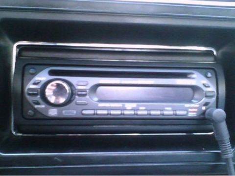 2000 Mercury Grand Marquis - Close-up of a car's audio system, showing the radio and CD player controls.