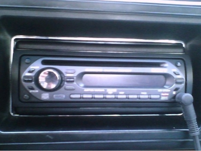 Car stereo with a large dial and several buttons