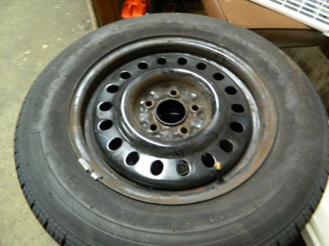 1995 Honda Civic - A single tire and wheel assembly is shown, with visible text on the tire's sidewall.