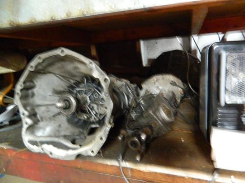 1995 Honda Civic - Disassembled transmission parts are visible on a shelf next to a heater.