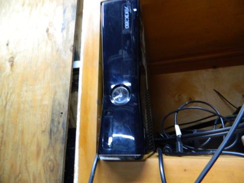 1995 Honda Civic - A black Xbox 360 console is visible, with the text 'XBOX 360' clearly displayed on its side.
