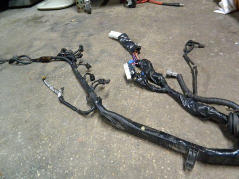 1995 Honda Civic - Automotive wiring harness with multiple connectors and black tape wrapping.