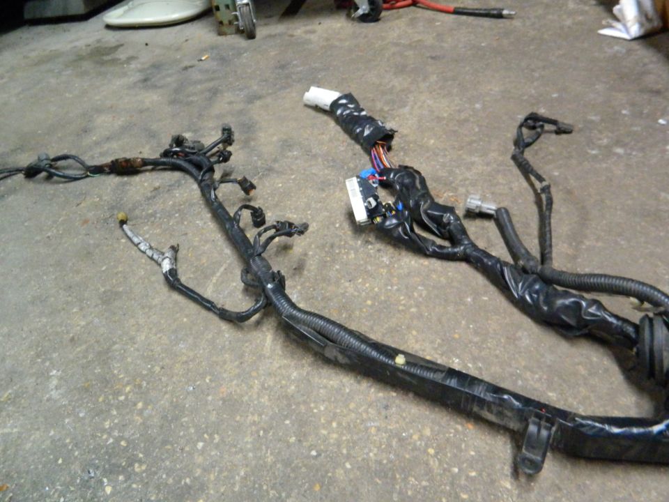 automotive wiring harness laid out on concrete floor