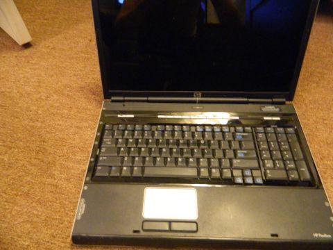 1995 Honda Civic - Laptop computer with a full keyboard and numeric keypad is shown on a carpeted surface.