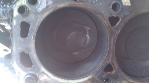 1973 Ford Torino - The internal view of an engine's cylinder block reveals pistons within their bores.