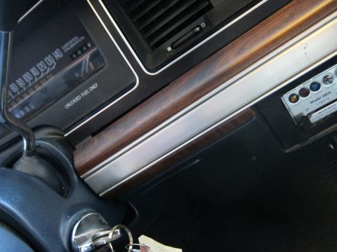 1991 Ford LTD Crown Victoria - Close-up of a car's dashboard, showing the speedometer and a control panel with several buttons.