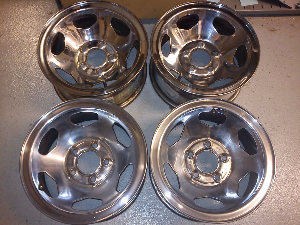 four chrome wheels with five lug nut holes
