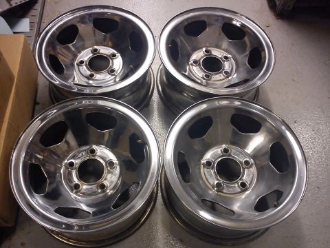 1997 Chevrolet Silverado 1500 - Set of four chrome wheels, likely aftermarket, with a five-lug pattern and open spoke design.