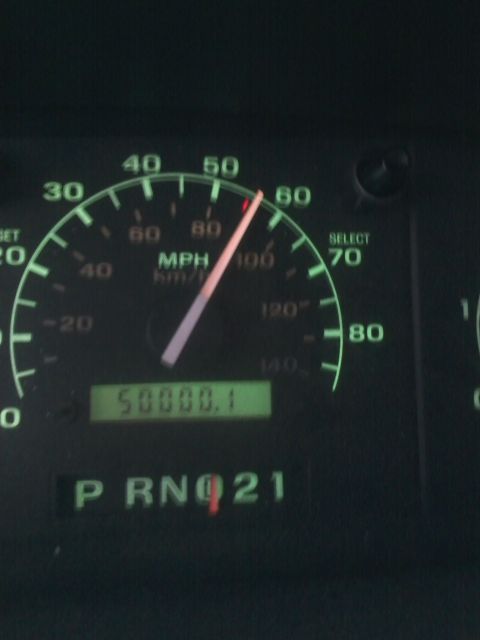 1994 Ford Bronco - The speedometer reads 55 MPH, and the odometer shows 50000.1 miles on this vehicle's dashboard.