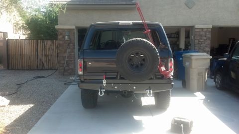 1995 Ford Bronco - This Ford Bronco is equipped with a spare tire and a Hi-Lift jack, ready for off-road adventures.