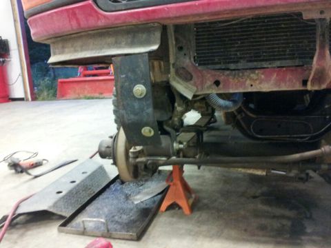 1995 Ford F-150 - Front end of a 1995 Ford F-150 showing the new bumper mounting bracket and radiator assembly.