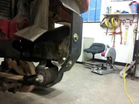 1995 Ford F-150 - Custom bracket installed on truck frame near suspension components.