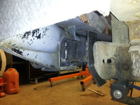 1995 Ford F-150 - Close-up of a custom bumper mount fabrication, showing welded steel components.