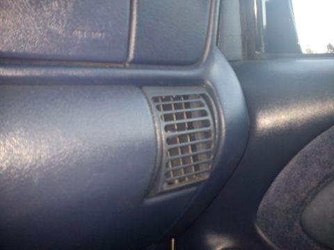 1997 Chevrolet Silverado 1500 - Close-up of the dashboard air vent in a 1997 Chevrolet Silverado 1500.