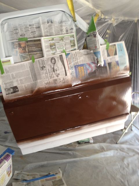 1986 Ford Bronco - Car door is masked with newspaper and being painted brown.