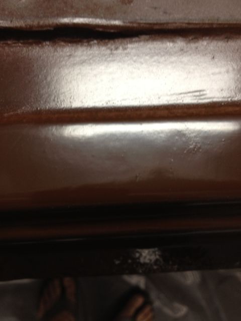 1986 Ford Bronco - Detail of a car's interior paneling, showing the texture and finish of the material.