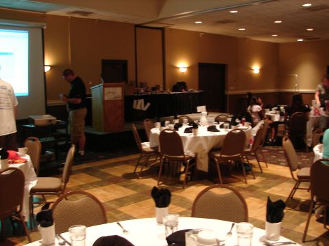 1992 Ford Taurus - A convention event is underway in a banquet hall with attendees seated at tables.