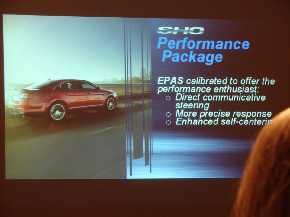 Red sedan side view with SHO Performance Package text