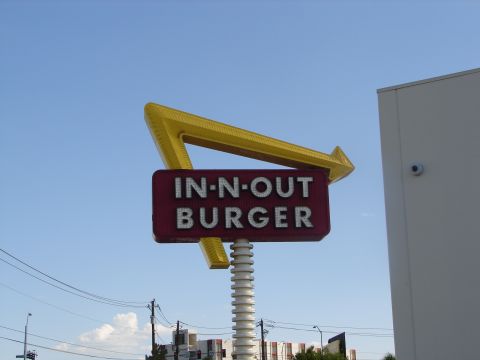 1992 Ford Taurus - Iconic In-N-Out Burger sign with its distinctive arrow and red message board.