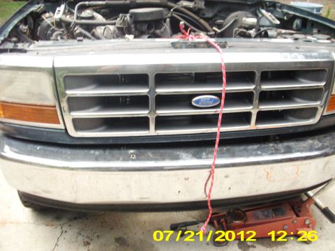 1995 Ford Bronco - I had that rope tied to the radiator support where the hood latch was & then to the hood, where the safety catch was at on the hood along w…