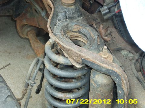 1995 Ford Bronco - The right spring here has already shifted about a 1/2 inch outwards (towards the wheel), as there is nothing left to the base of this shock…