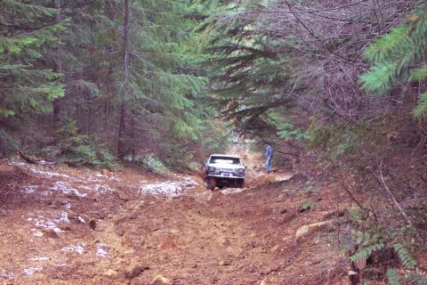 1996 Ford Bronco - Todd trying to make it up the big hill at top of Firebreak Five. It was just a little too slimy and the winch cable had to be pulled.