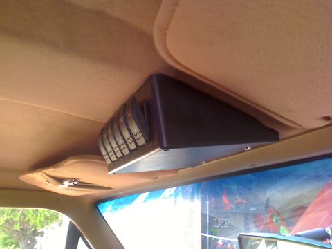 1990 Ford Bronco - An aftermarket switch panel is installed above the windshield inside the vehicle's cabin.