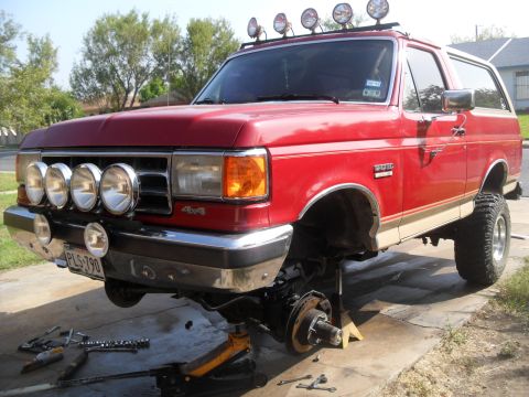 1990 Ford Bronco - This 1990 Ford Bronco is up on jack stands with its front end disassembled for work.